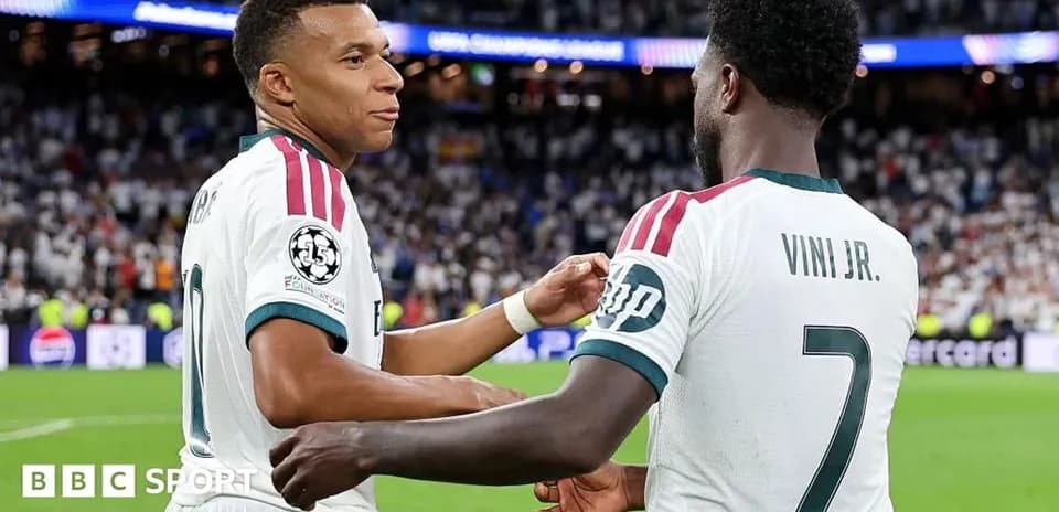 Mbappé and Viní Jr. celebrating on the pitch