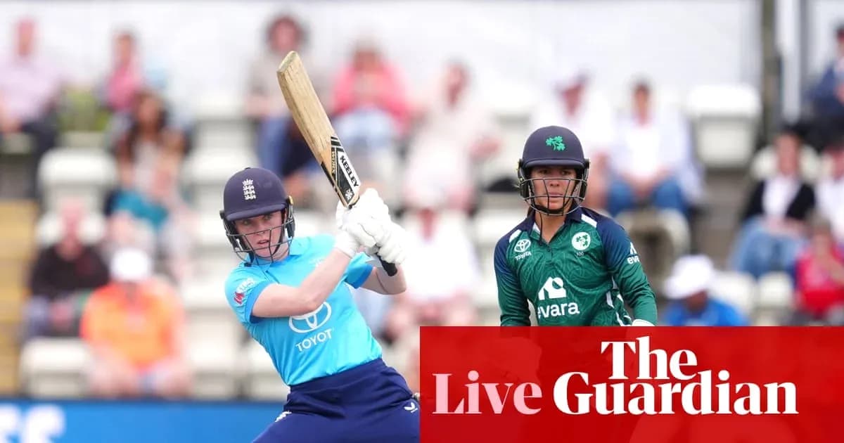 England player batting with Ireland player in background