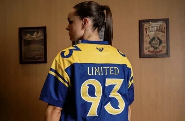 Person wearing a blue and yellow United jersey