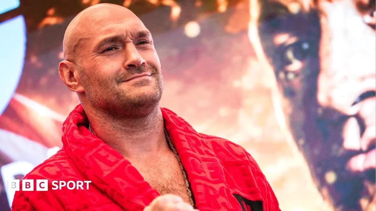 Boxer in red robe at promotional event