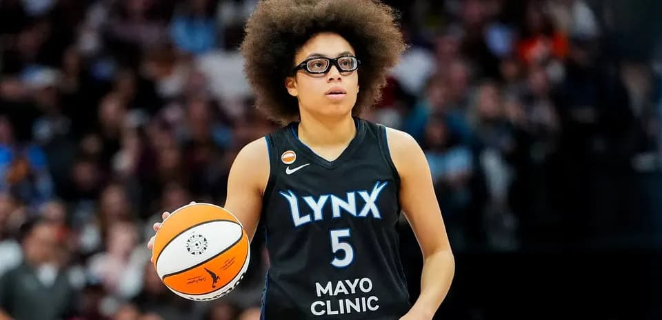 Player holding basketball during game action