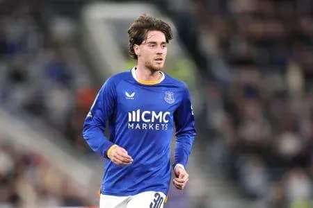 Player in blue jersey running on the field
