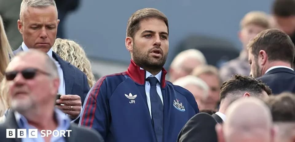 Man in Newcastle kit standing among crowd