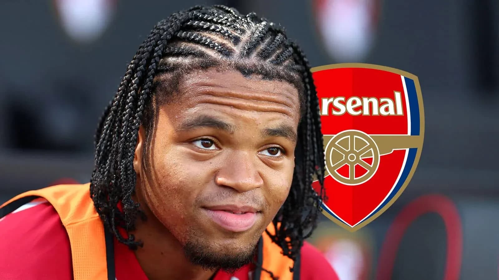 Player with braided hair near Arsenal logo
