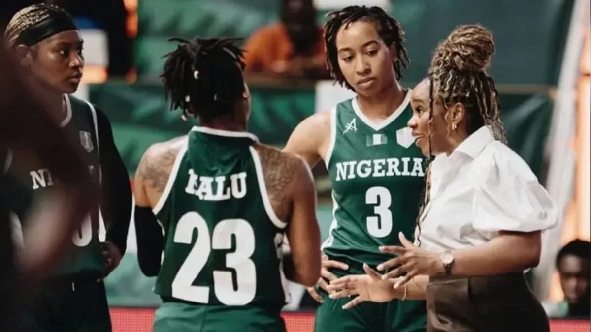 Coach discussing strategy with Nigerian basketball players
