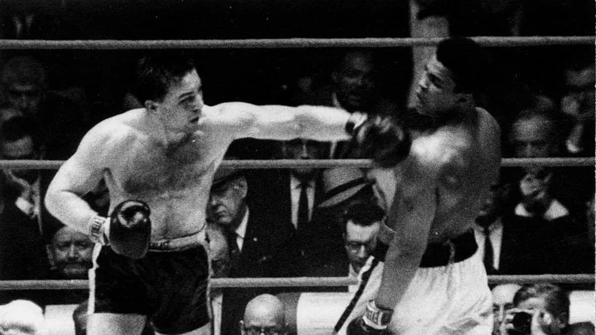 Boxers exchanging punches in a boxing match