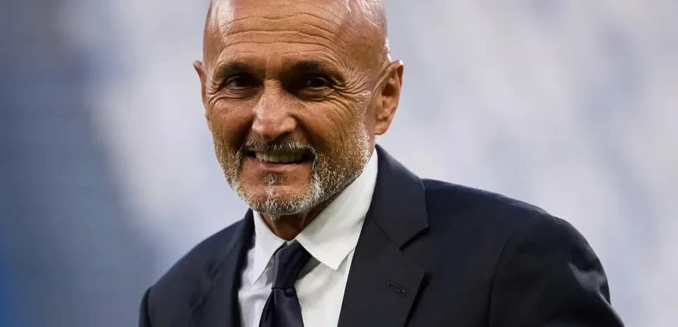 Man in suit smiling at the camera