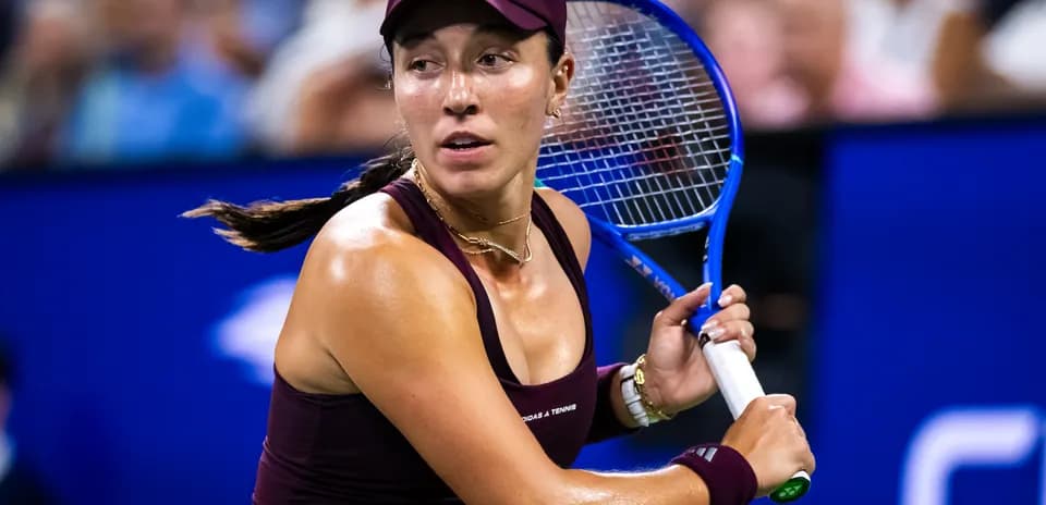 Female tennis player preparing to hit the ball