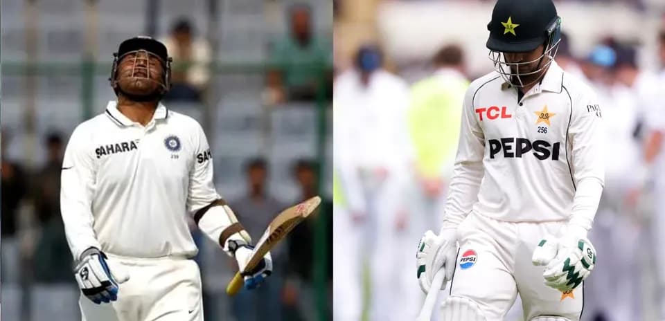 Two cricketers walking off the field in whites