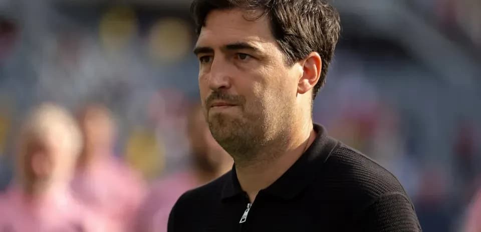 Coach observing players before the match