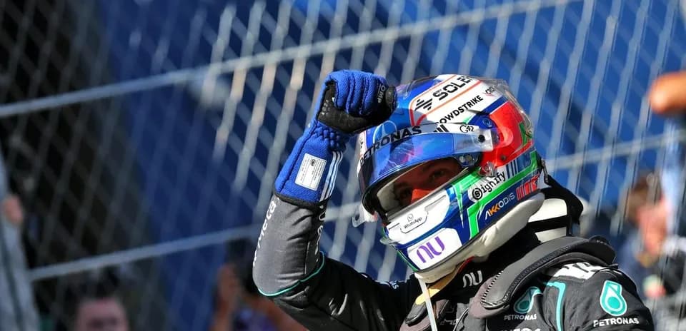 Driver celebrating with raised fist after race