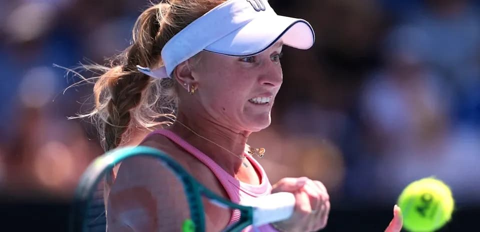 Tennis player hitting a forehand during match