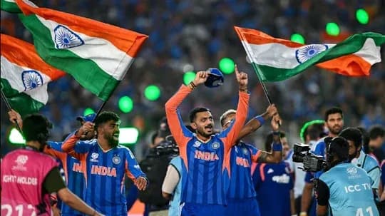 Indian players celebrating with flags after victory