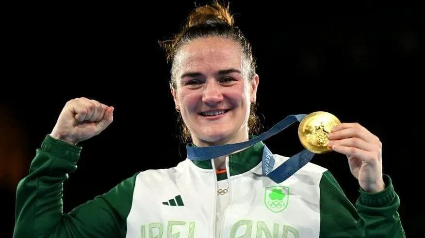 Athlete celebrating with gold medal after victory