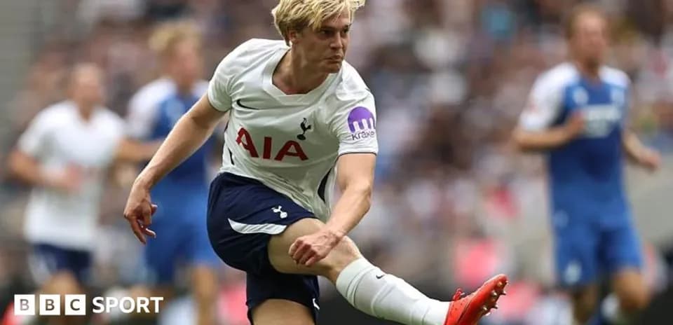 Player kicking the ball during a football match