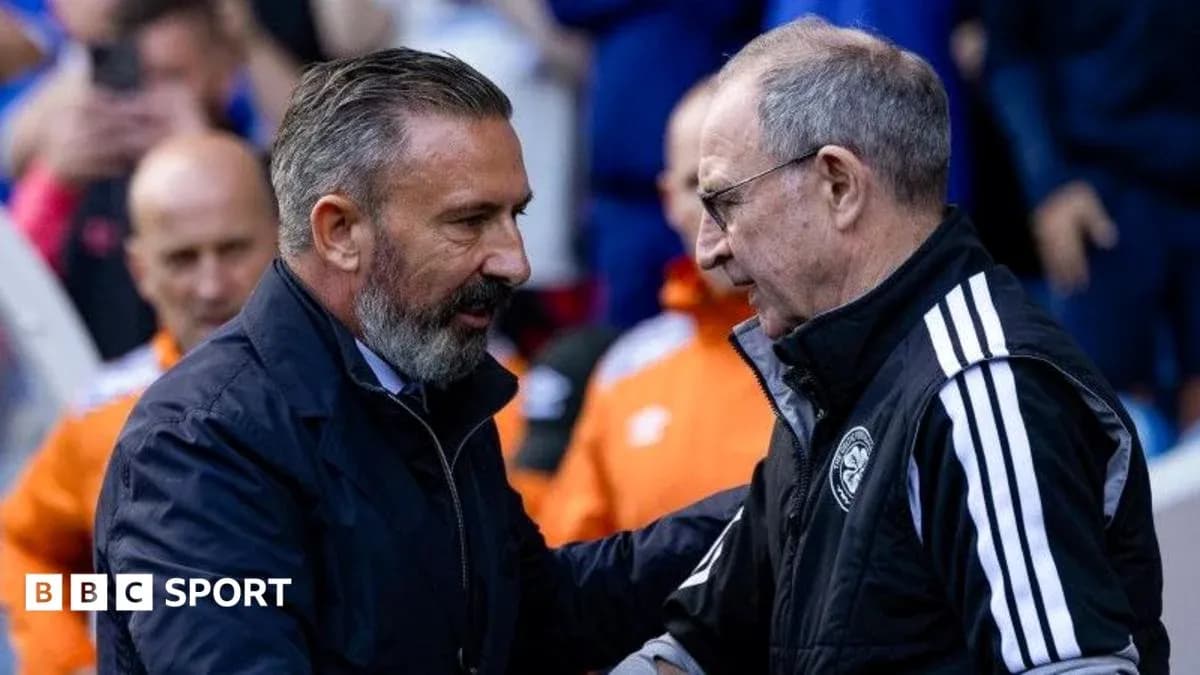 Two football managers shaking hands before match