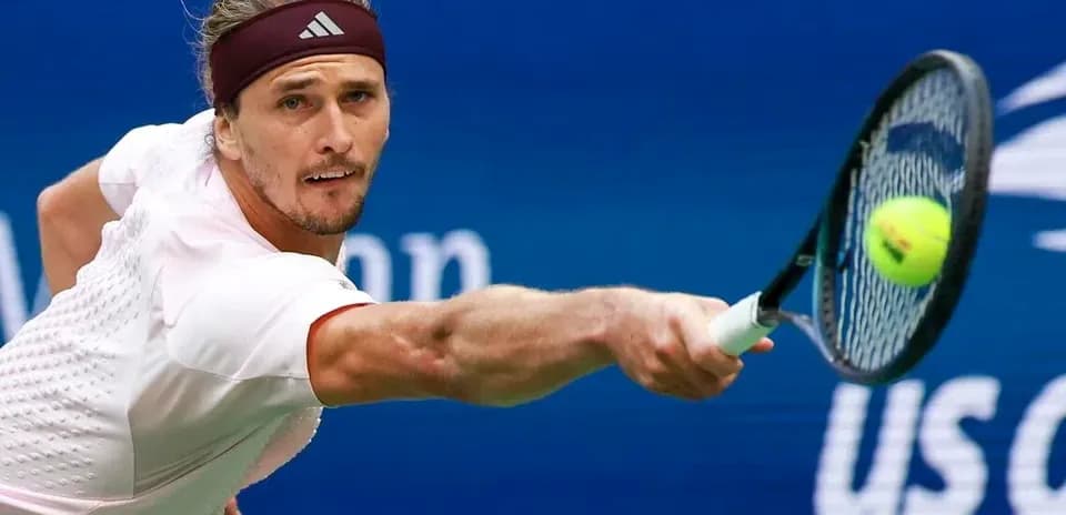 Player reaching for a tennis ball during match