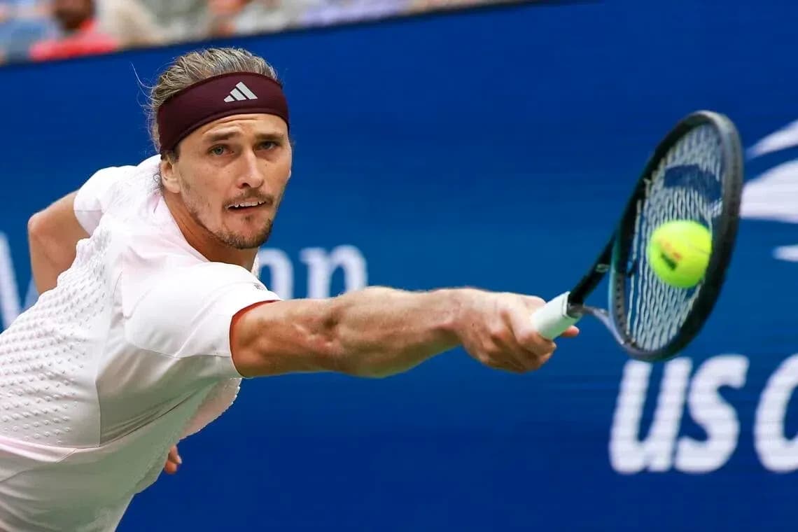 Player reaching for a tennis ball during match