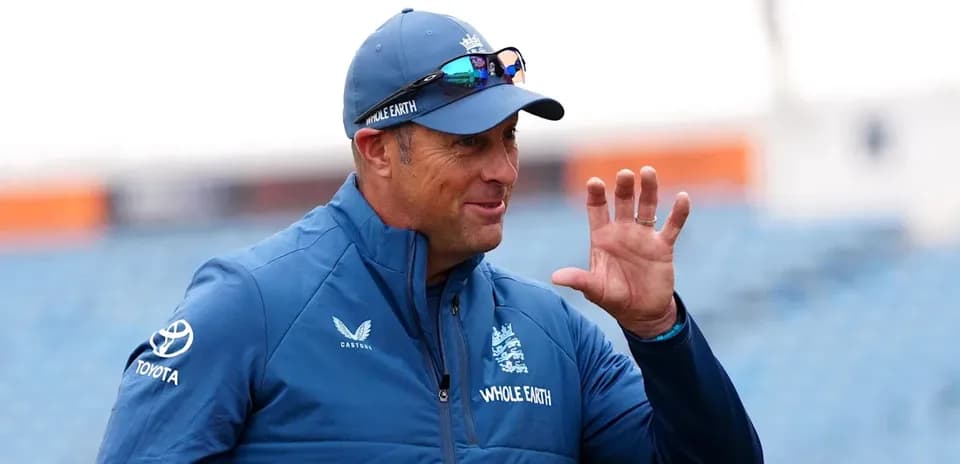 Cricket coach gesturing during practice session