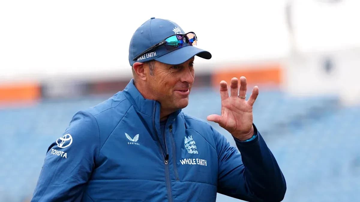 Cricket coach gesturing during practice session