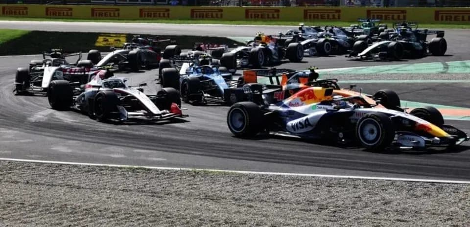 Multiple Formula 1 cars racing on track