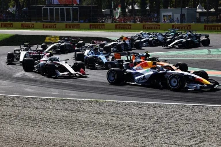 Multiple Formula 1 cars racing on track