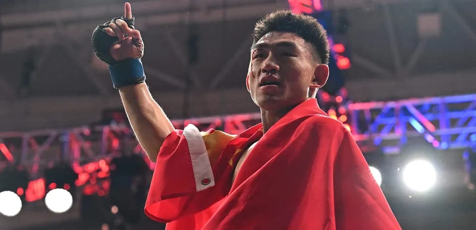 Boxer celebrating victory with flag in arena