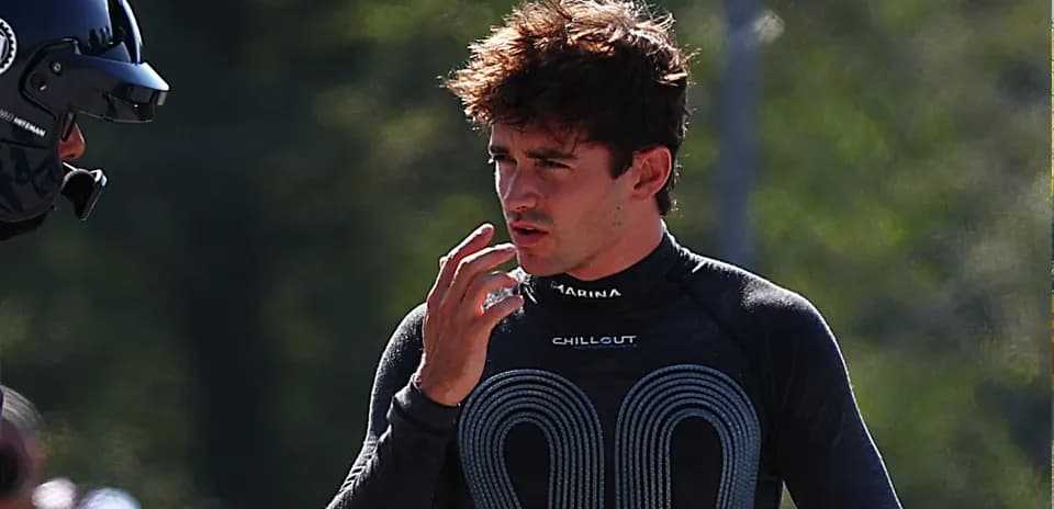 Driver discussing strategy during practice session