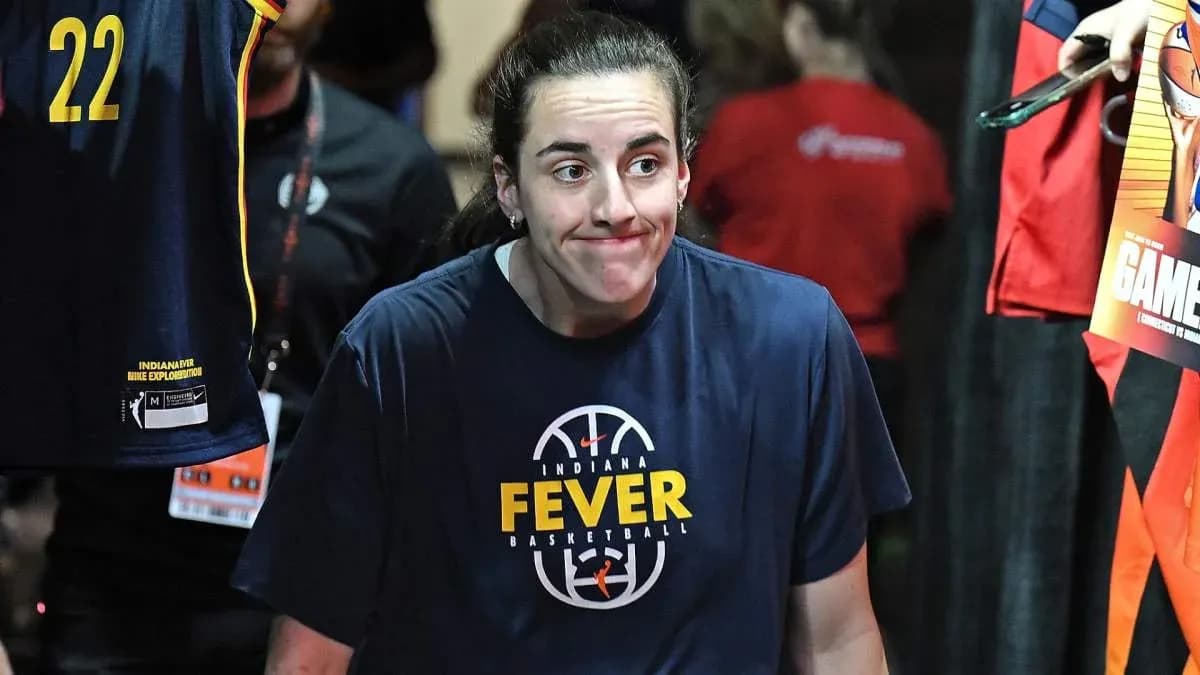 Player in Indiana Fever shirt walking in tunnel