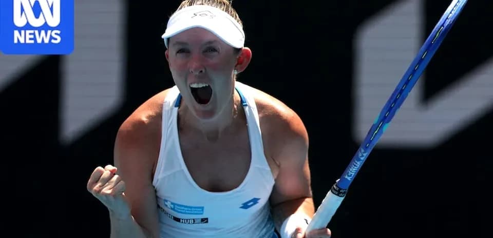 Tennis player celebrating with racket after winning point