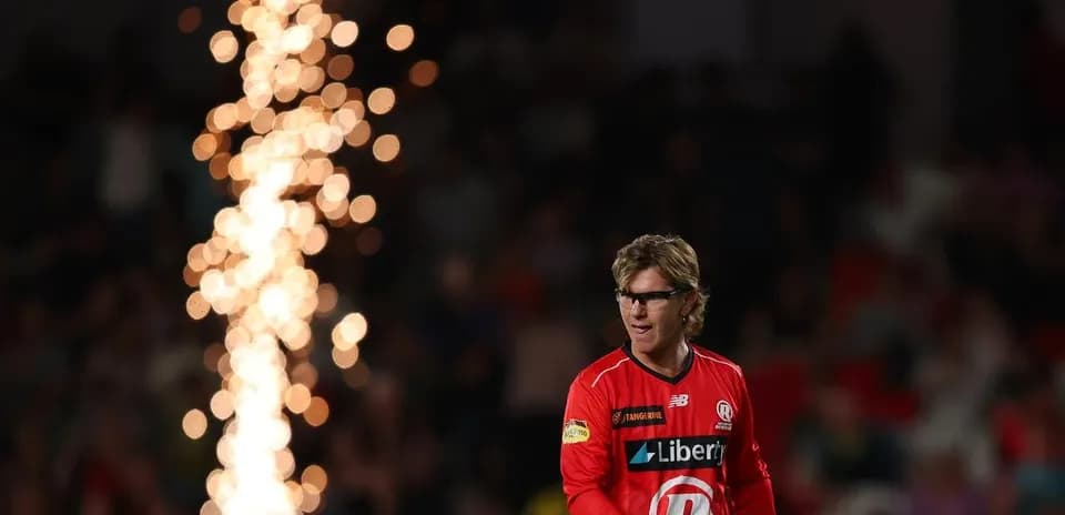 Player walking past fireworks during match celebration