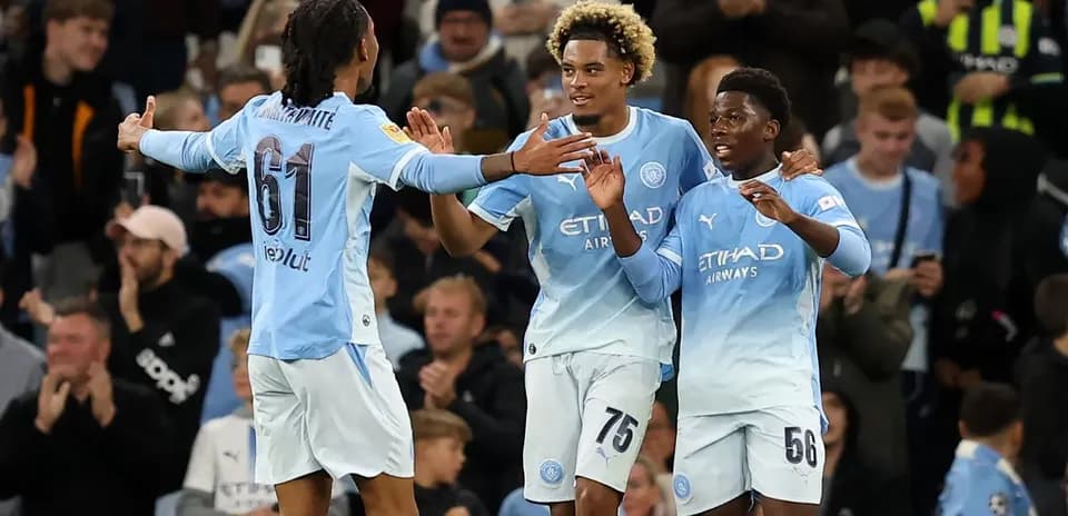 Manchester City players celebrating a goal together