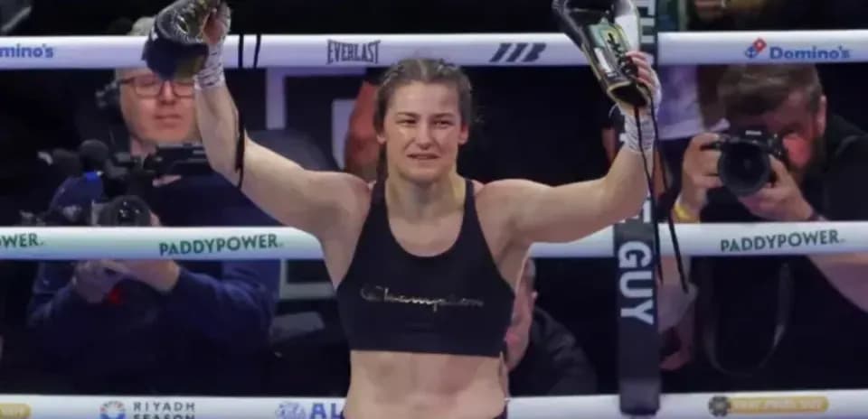 Katie Taylor celebrating victory in boxing ring