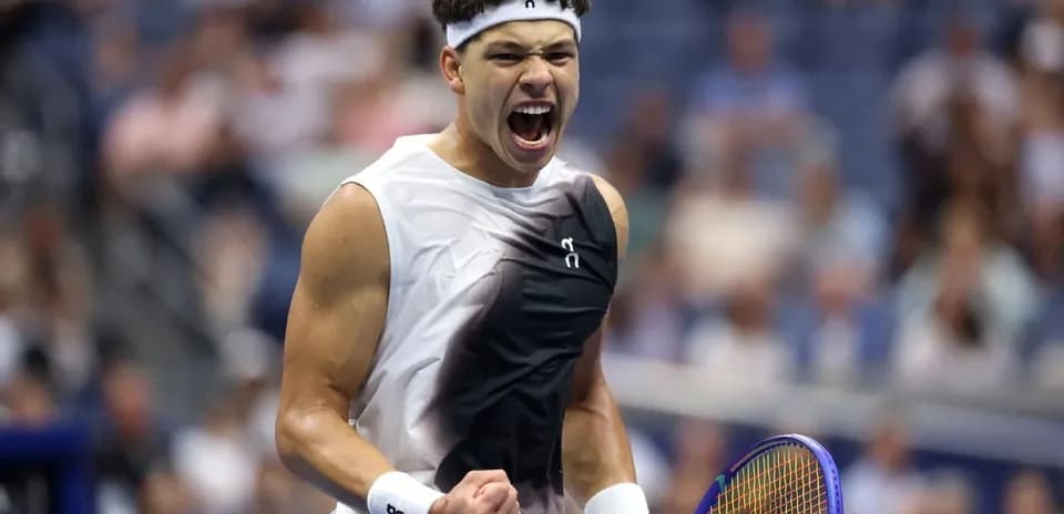Tennis player celebrating with raised fist during match