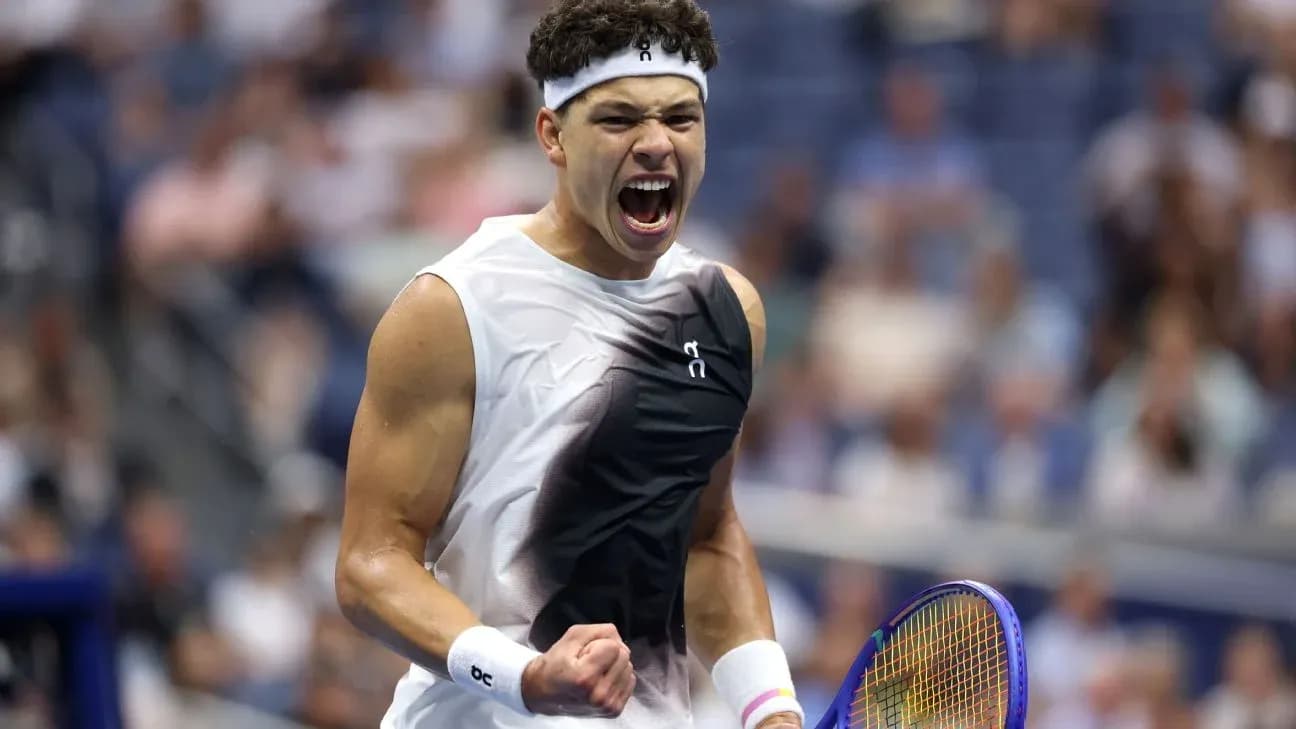 Tennis player celebrating with raised fist during match