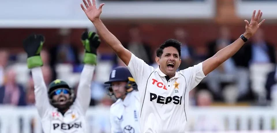 Bowler celebrating a wicket with teammates during match