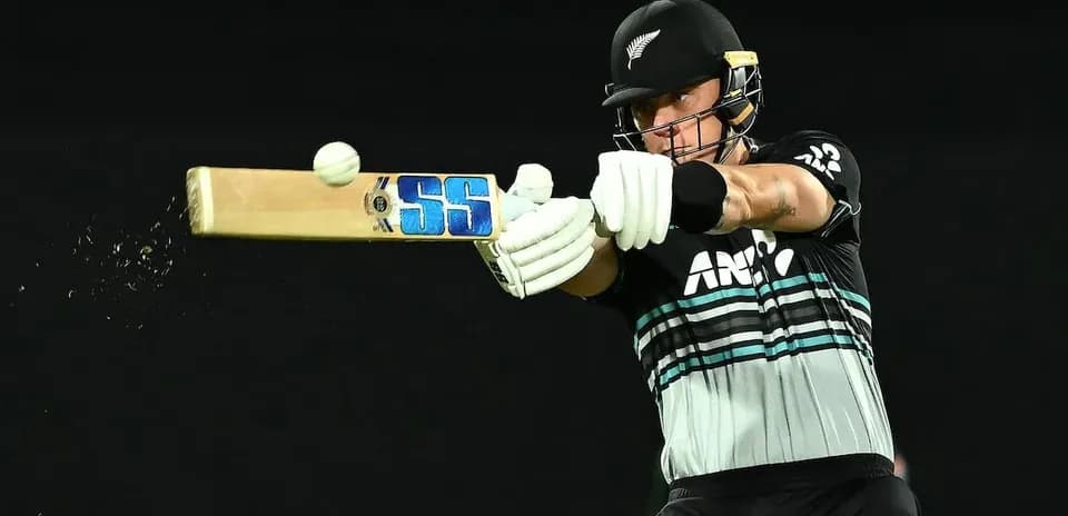 Batsman striking a cricket ball with bat