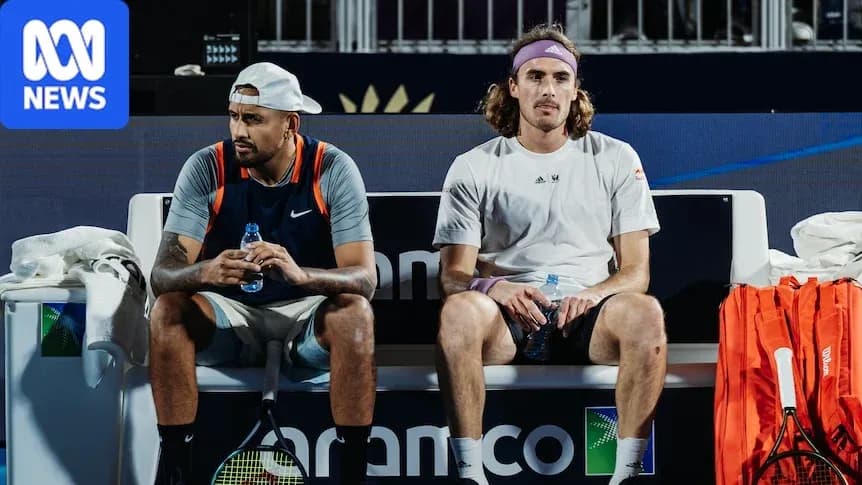 Tennis players seated on bench during match break