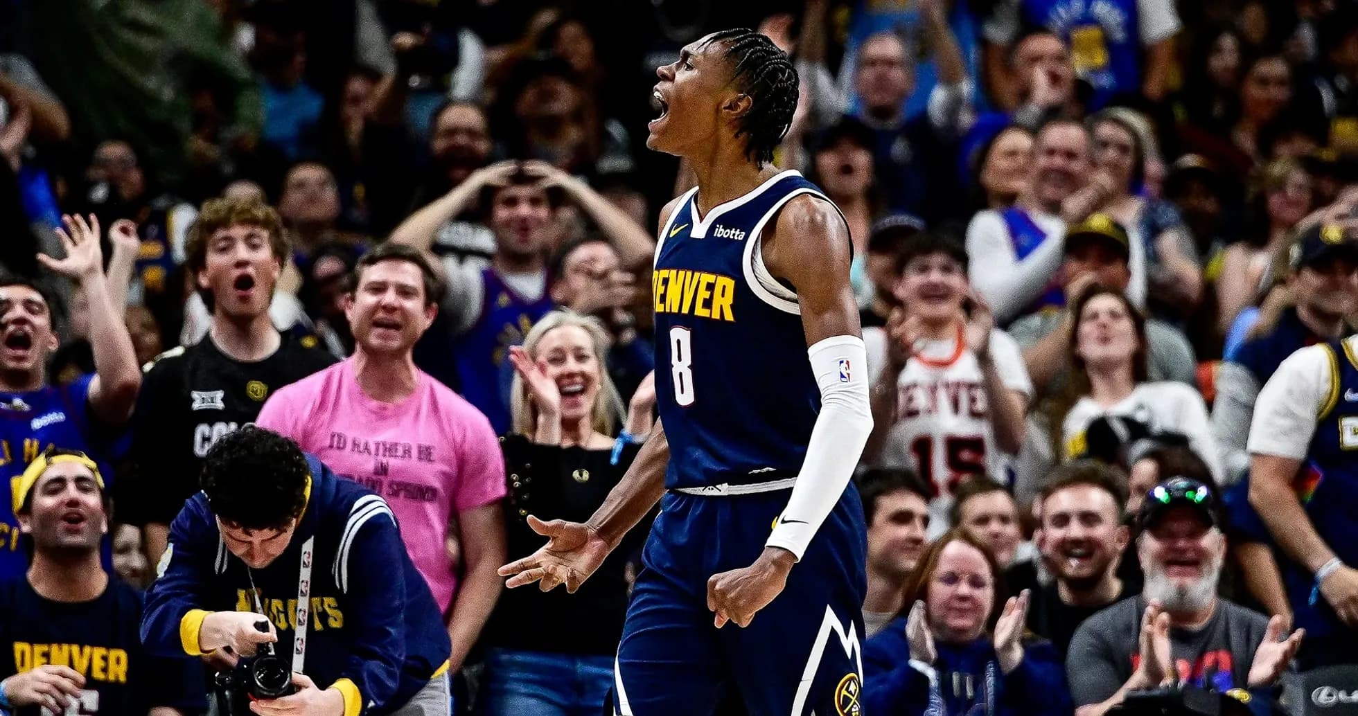 Denver player celebrating in front of cheering crowd