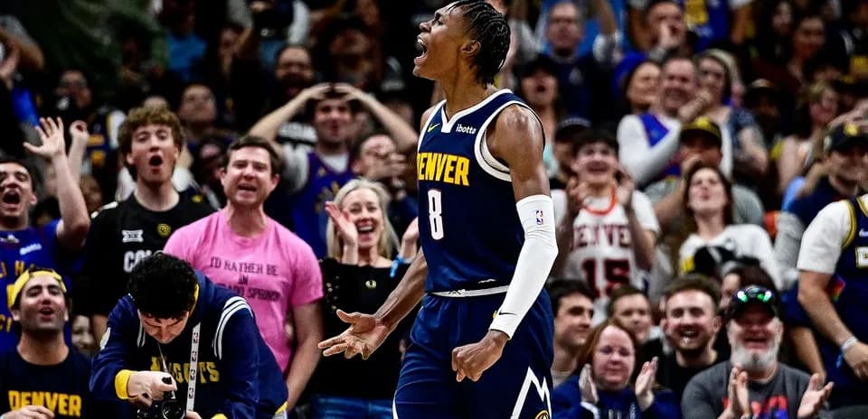 Denver player celebrating in front of cheering crowd