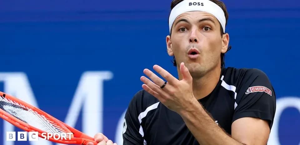 Tennis player reacting during a match on court