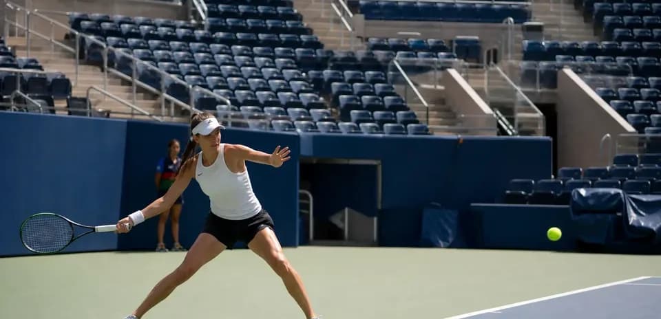 Female tennis player preparing to hit a ball