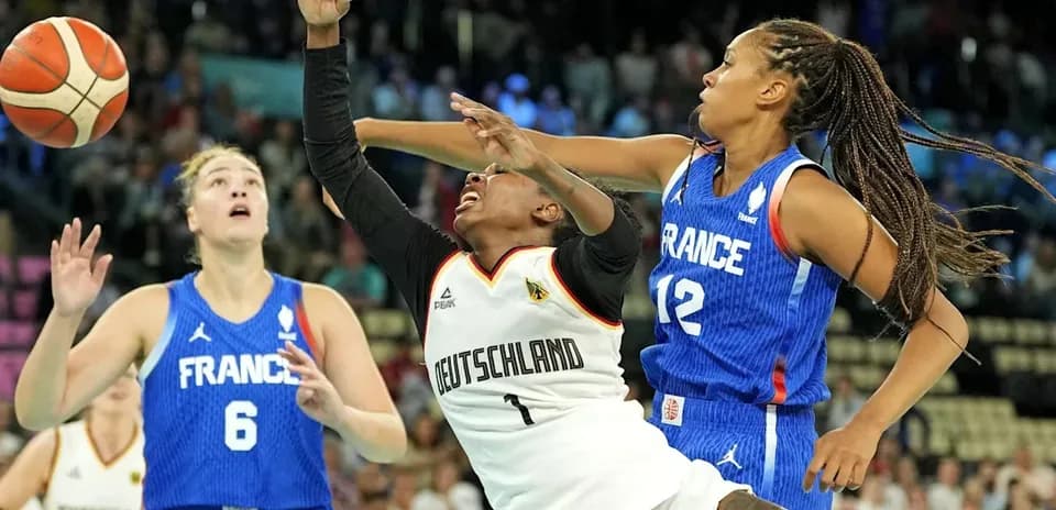 Players from Germany and France competing for the ball