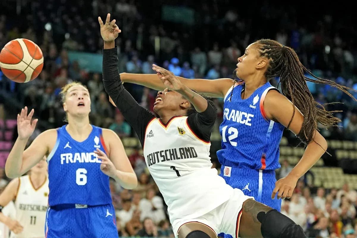 Players from Germany and France competing for the ball