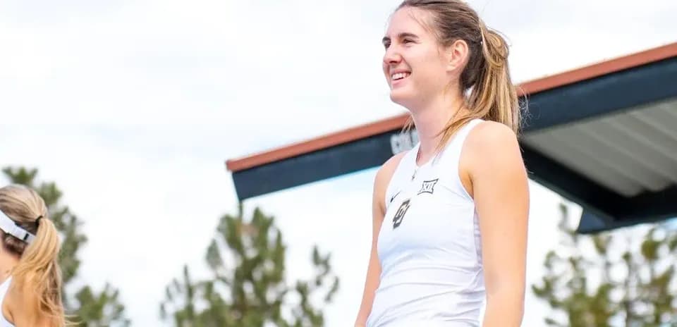 Female tennis player on court smiling during event