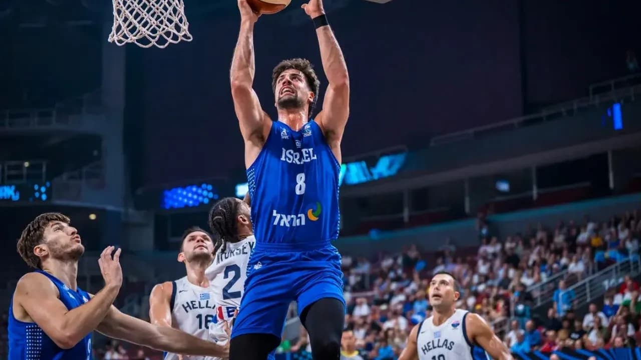Player jumping for a dunk during basketball match