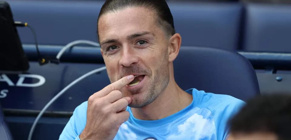 Player sitting on bench eating snack during match