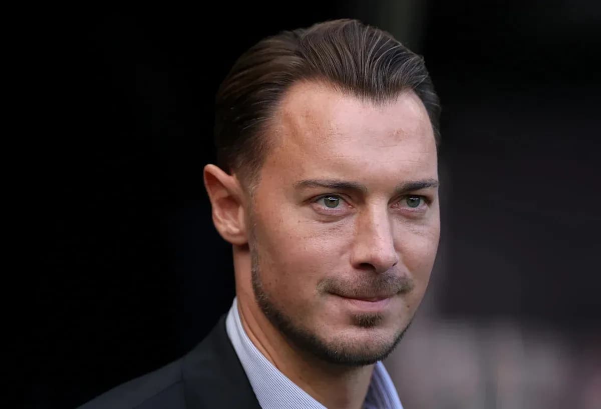 Man in suit with short hair and facial hair