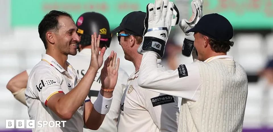 Players celebrating a wicket during cricket match