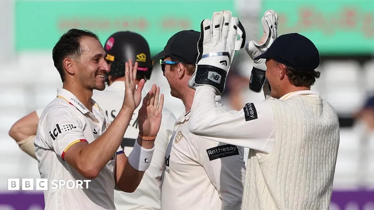 Players celebrating a wicket during cricket match